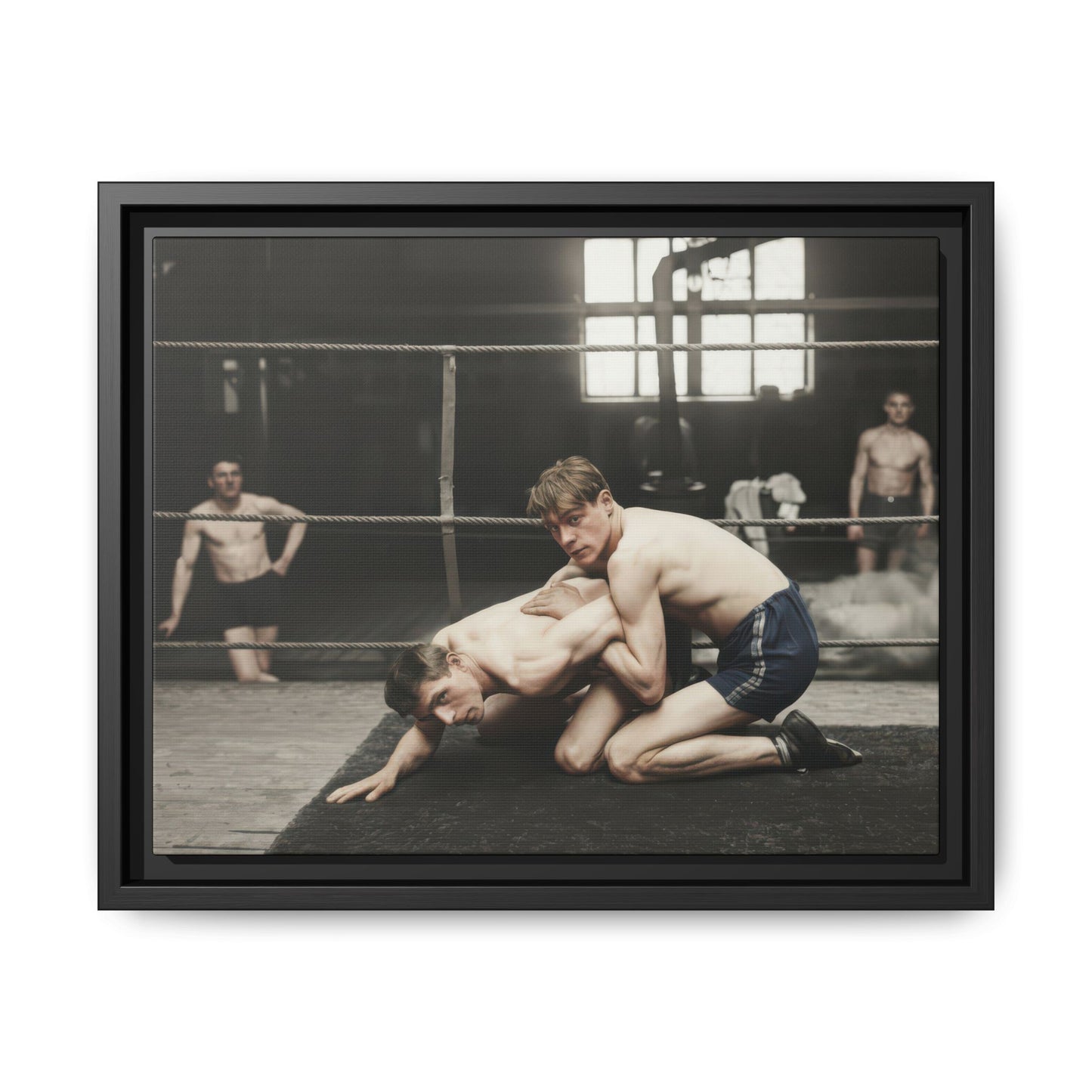Restored vintage photograph of two wrestlers in a grounded hold on a mat inside a ring 