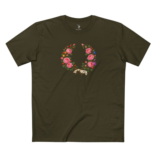 Syrian Damask rose laurel wreath with layered pink blooms, rainbow accents, green leaves, rosehips, and an ivory ribbon reading فخر.