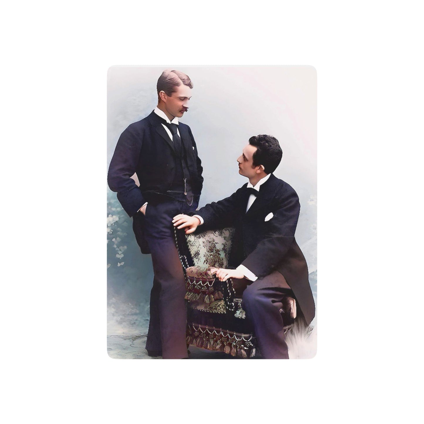 A restored vintage photo of a gay couple in formal attire, sharing a quiet moment of love and connection in a classic studio setting.