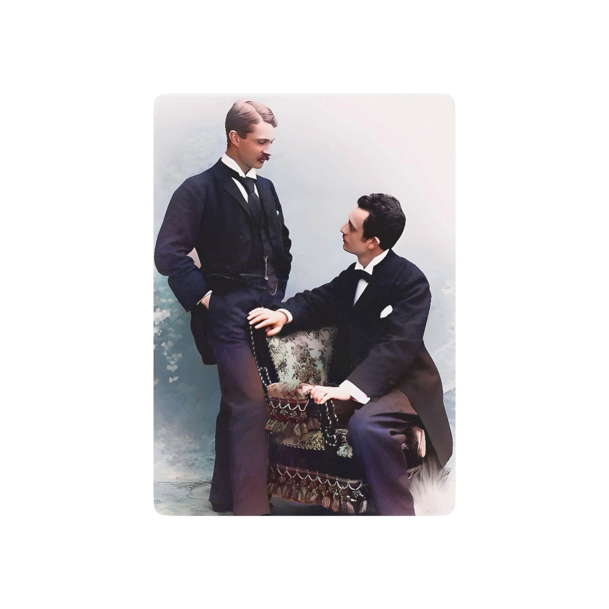 A restored vintage photo of a gay couple in formal attire, sharing a quiet moment of love and connection in a classic studio setting.