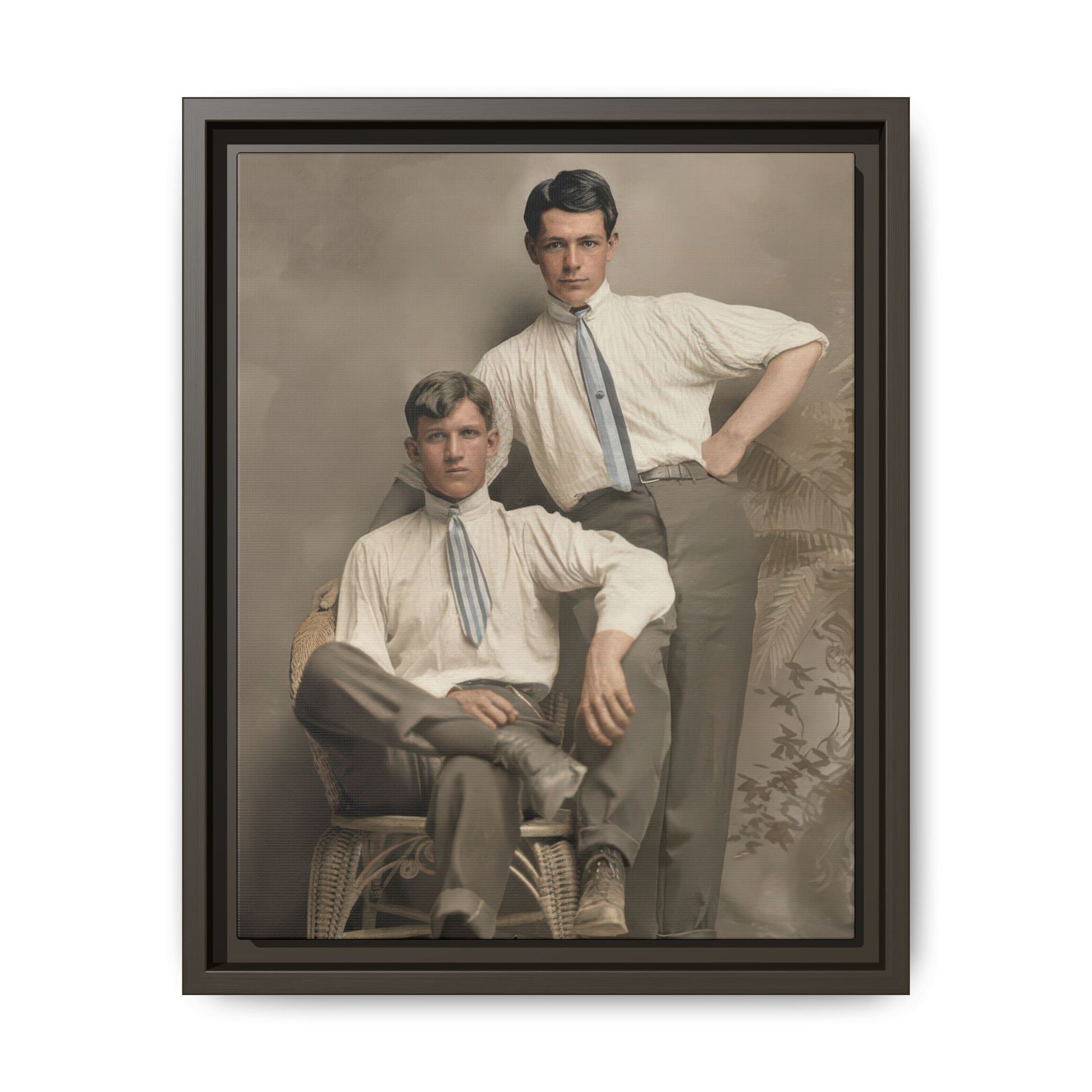 2.	Historical paired portrait showing two men in coordinated dress against a soft studio backdrop with decorative foliage