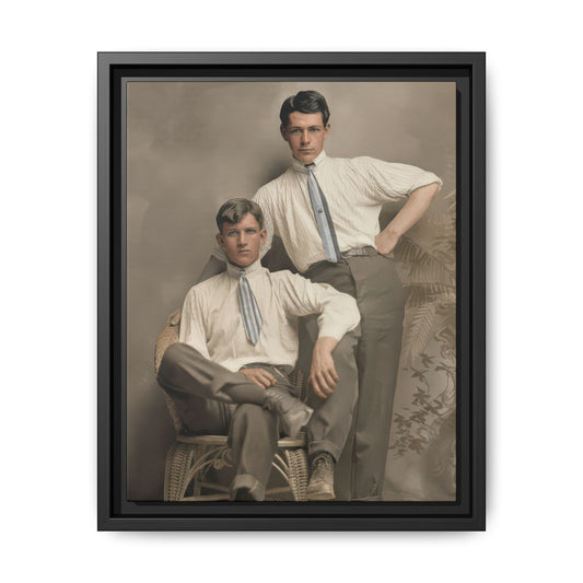 Vintage studio double portrait of two young men in light high-collared shirts with one seated in a wicker chair and one standing