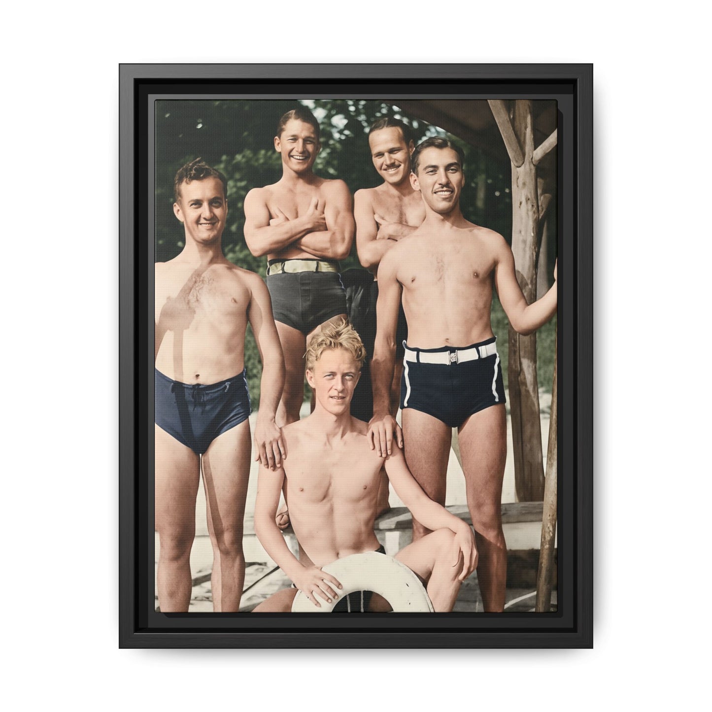 Restored vintage photograph of five men in swimwear posed on a wooden dock with lifebuoy 