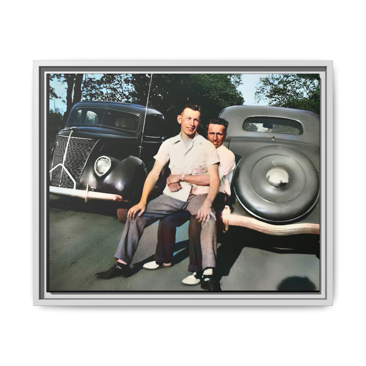 Restored 1930s vintage photo of Andrew and Eugene seated on a classic car bumper in Lincoln, Nebraska. Framed matte canvas art celebrating LGBTQ+ history, love, and timeless companionship.