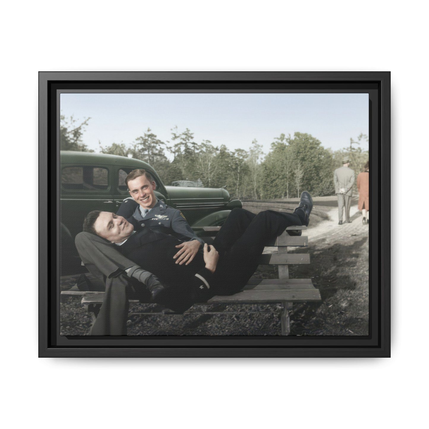 Vintage outdoor portrait of two men on bench beside classic automobile framed canvas wall art