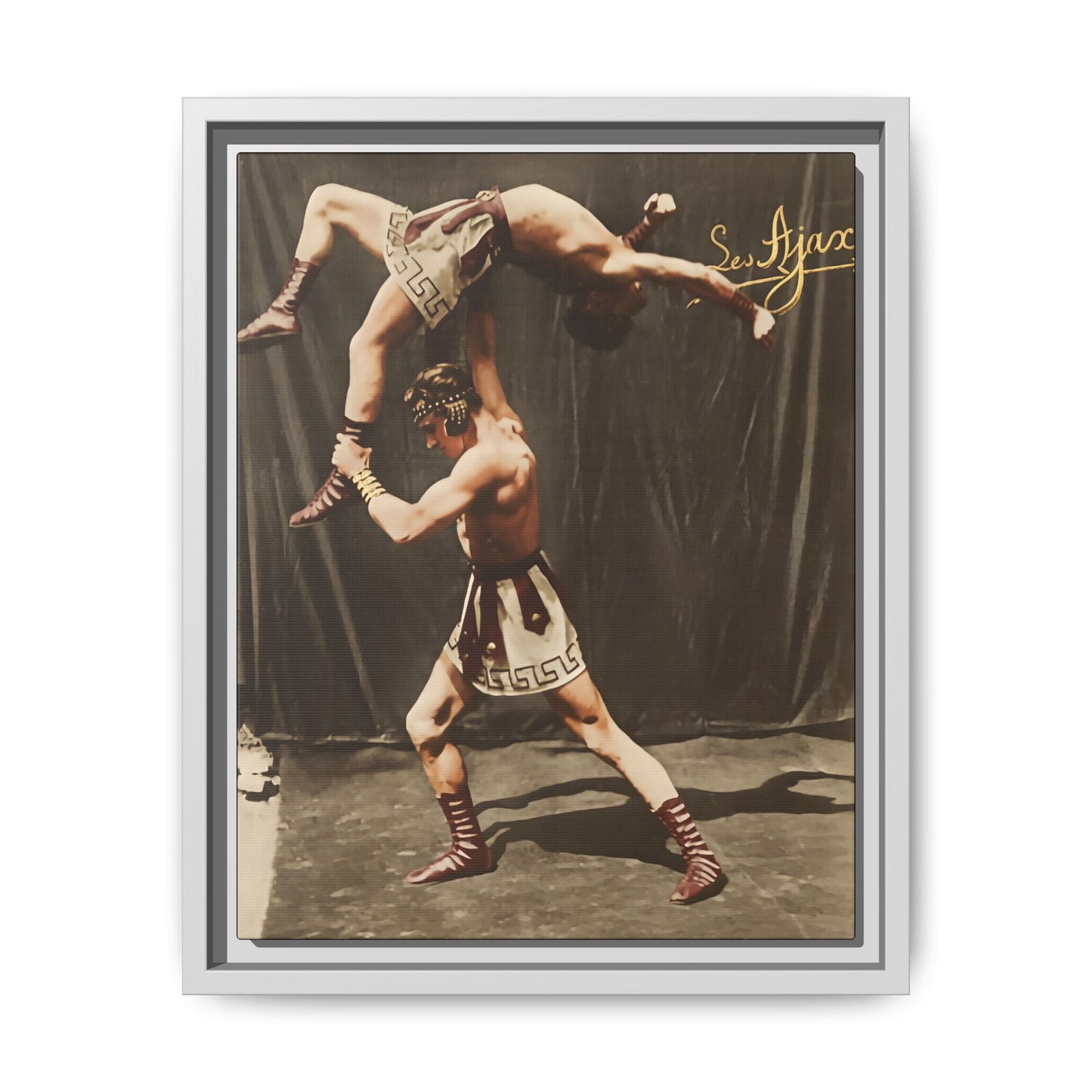 Vintage athletic performance photograph with Greco Roman costume and studio backdrop 