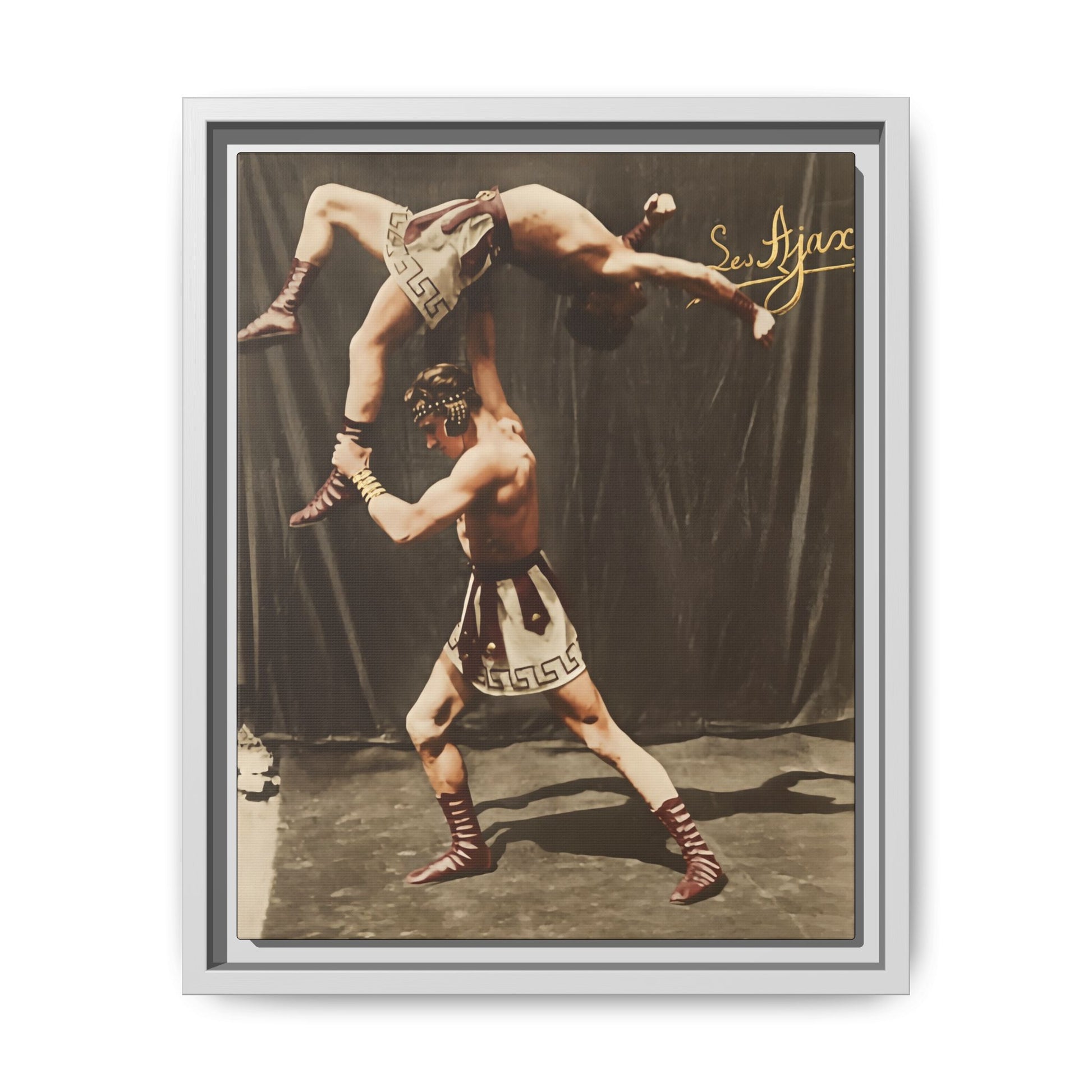 Vintage athletic performance photograph with Greco Roman costume and studio backdrop 