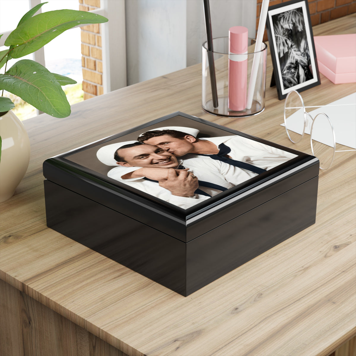 Angled glossy wooden keepsake box featuring a vintage sailor cheek-kiss photograph on its ceramic tile lid.
