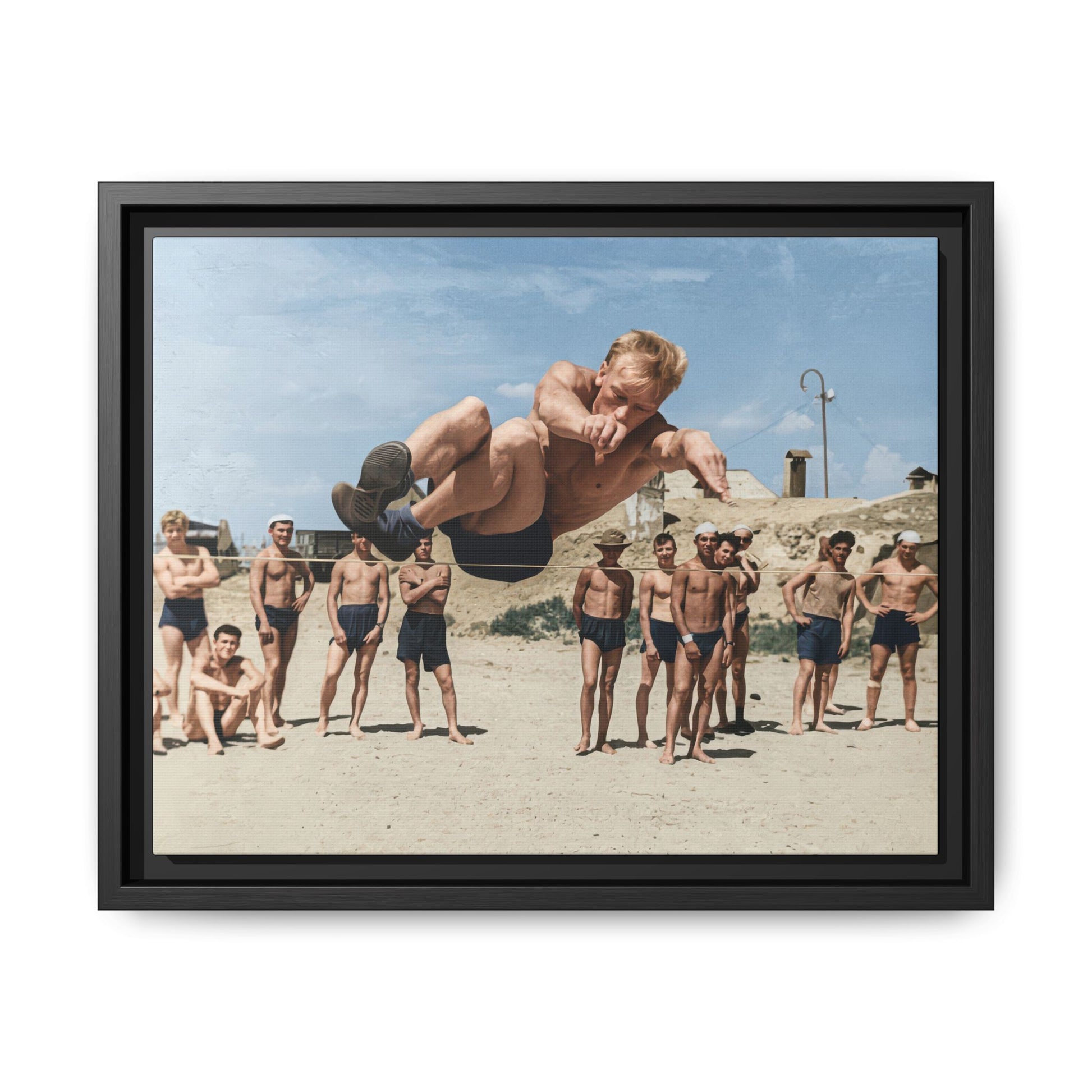 Vintage airborne jumper photograph reproduced as framed canvas wall art with spectators on sandy ground 