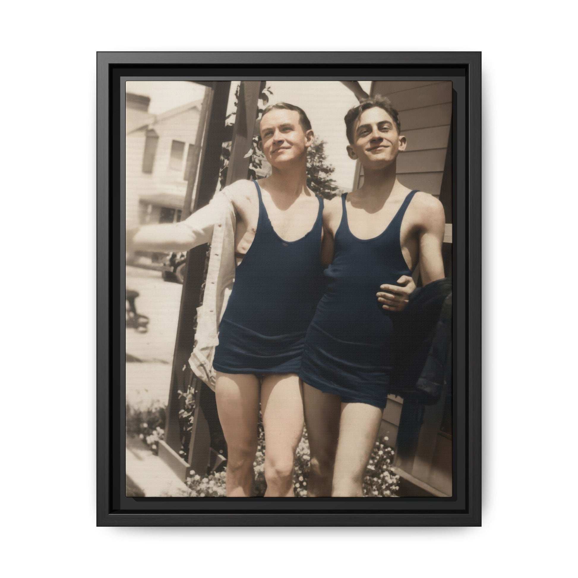 Two men in vintage swimwear standing beside porch in early 20th-century photograph 