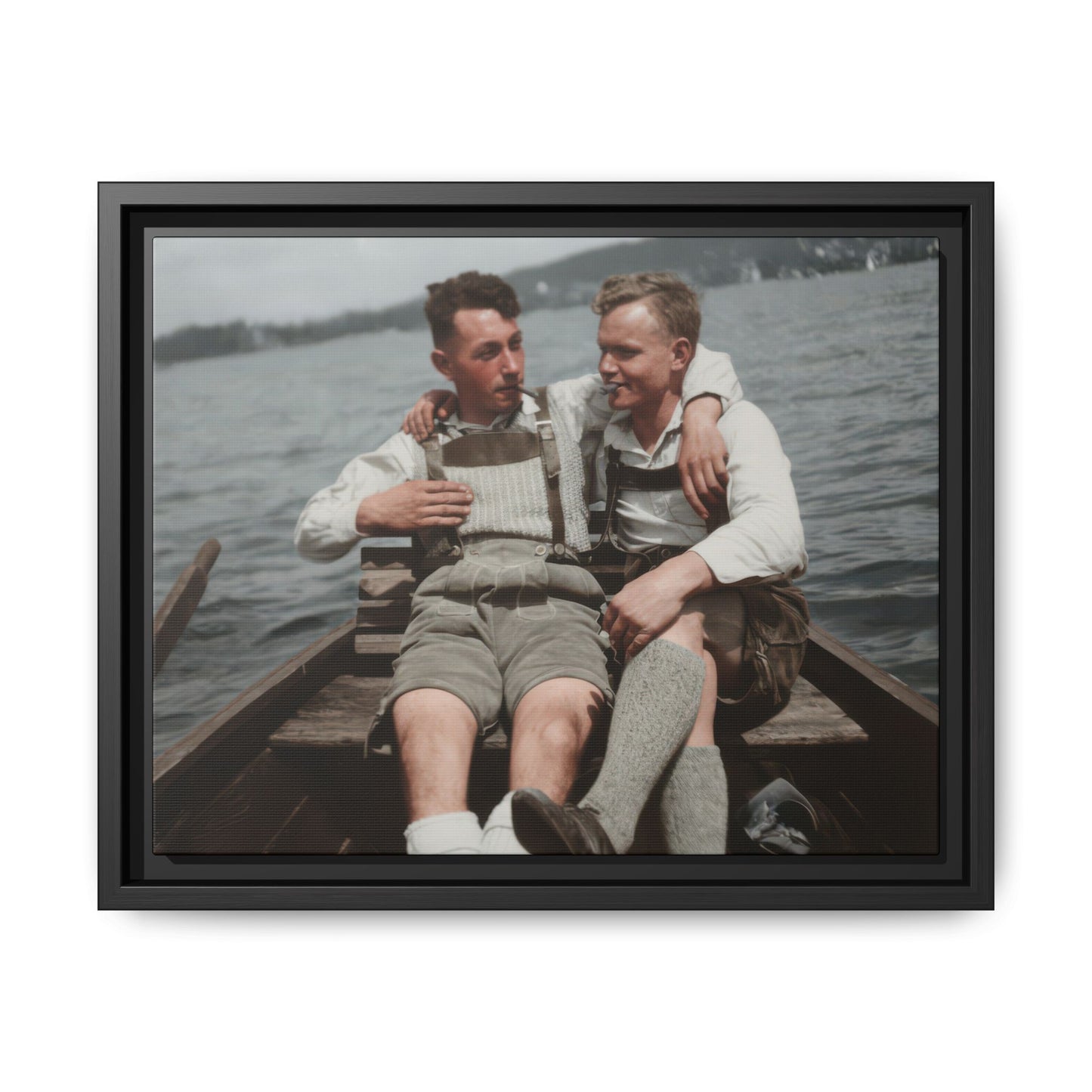 Vintage photograph of two companions seated in a wooden boat on water