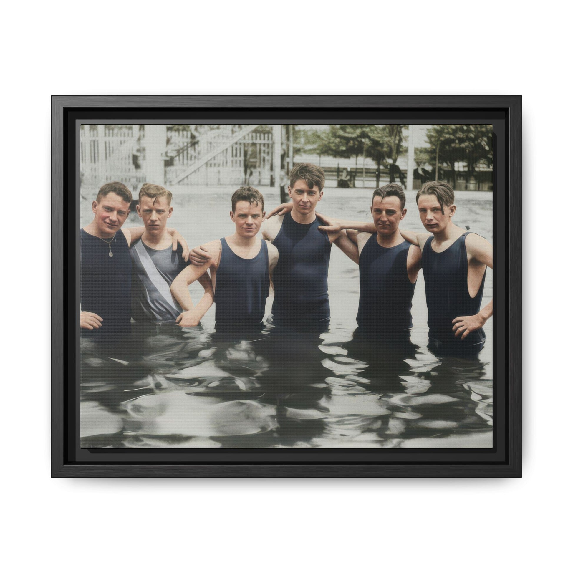 Restored vintage photograph of six bathers standing in shallow water in period swimwear 