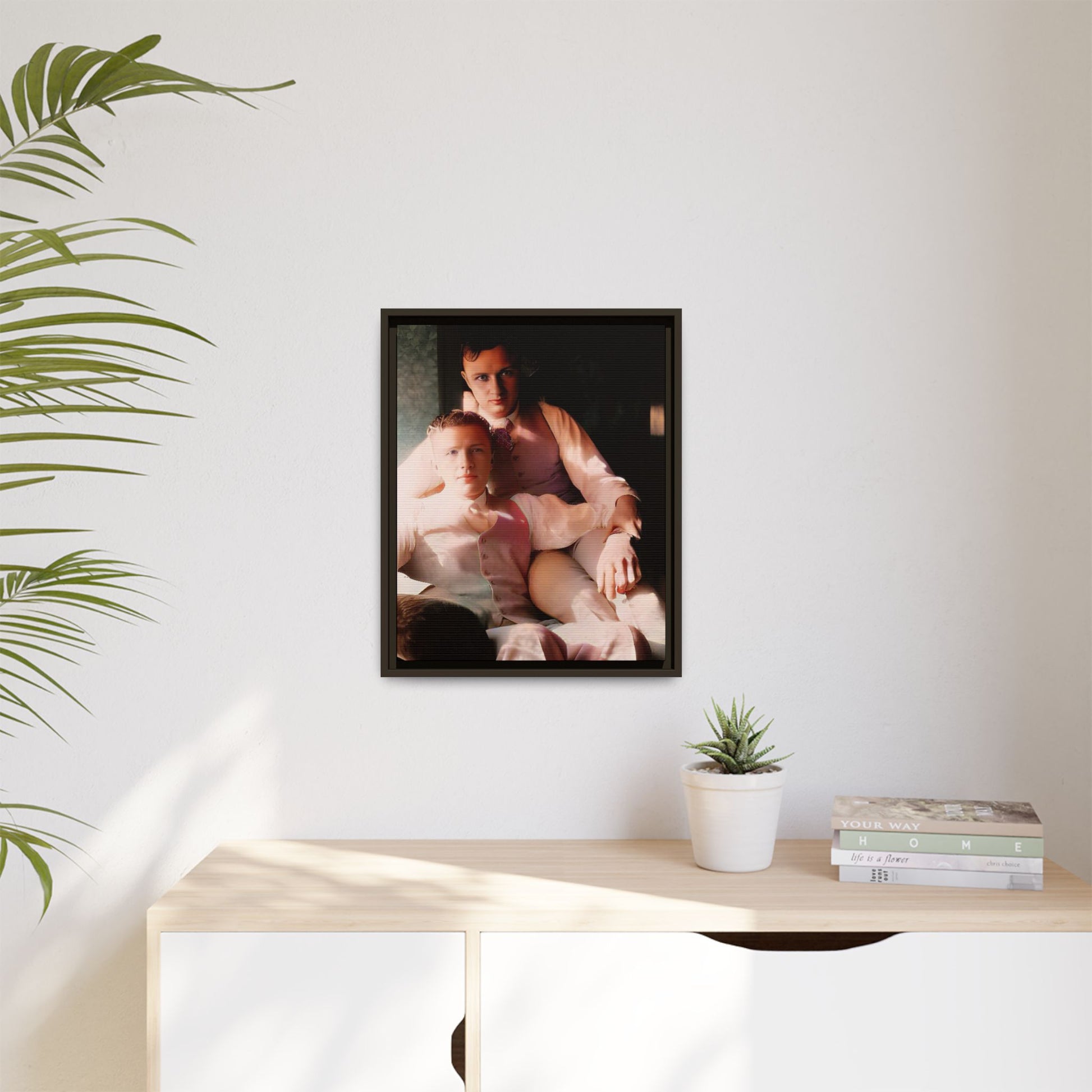 Restored vintage photograph of James and Henry, an early 1900s LGBTQ+ couple from Dayton, Ohio, sharing an intimate, sunlit moment. Framed matte canvas print celebrating love, devotion, and LGBTQ+ history.