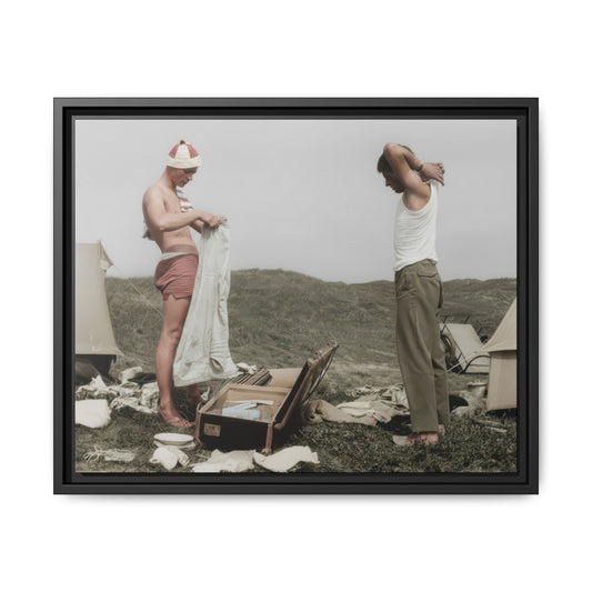Historical camp portrait showing two figures dressing outdoors in a tented landscape setting