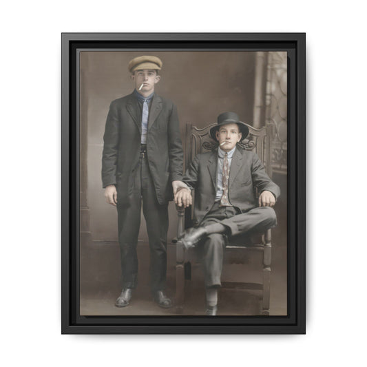 Early 20th century studio portrait of two young men with hats, suits, and cigarettes
