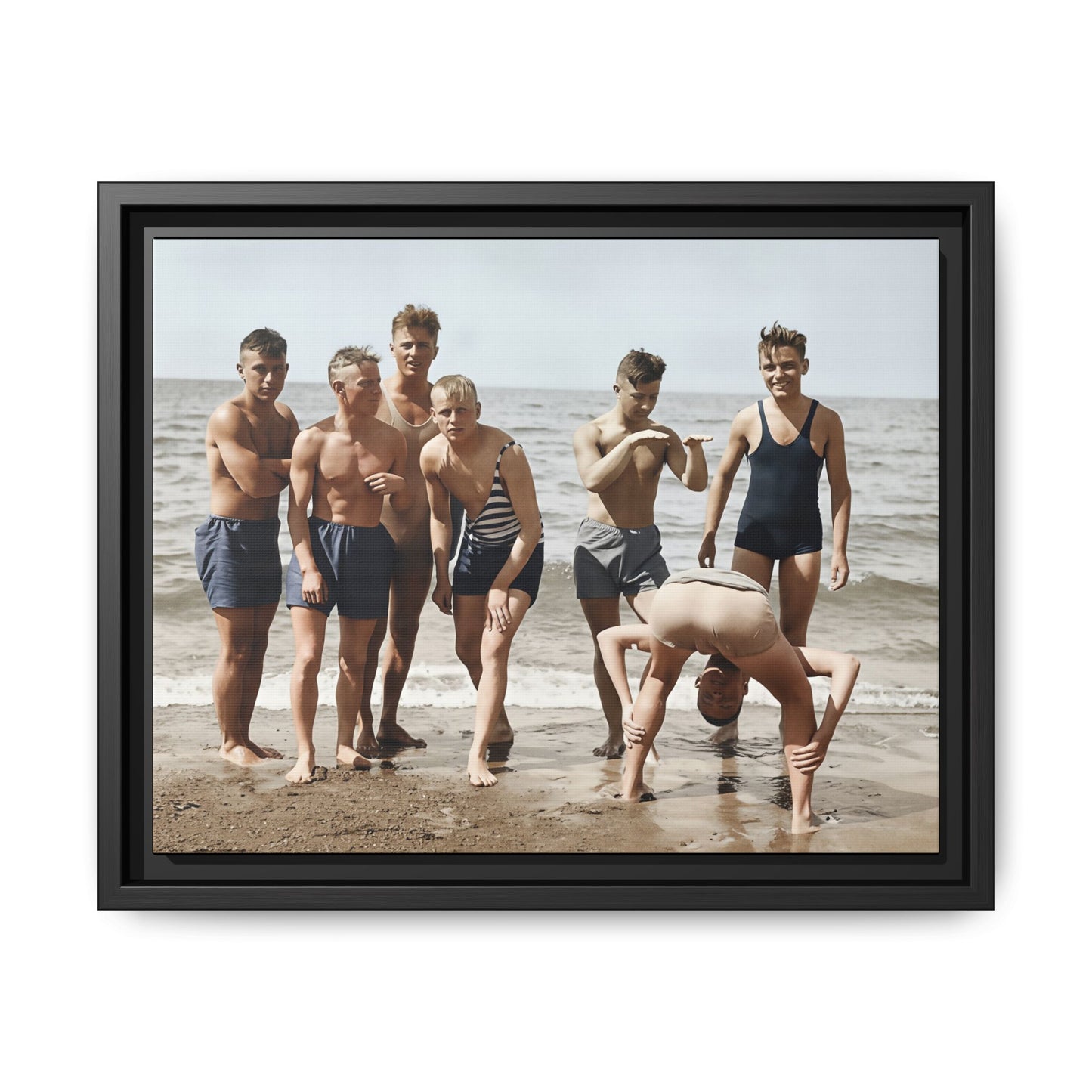Restored vintage photograph of boys at the shoreline in period bathing attire 