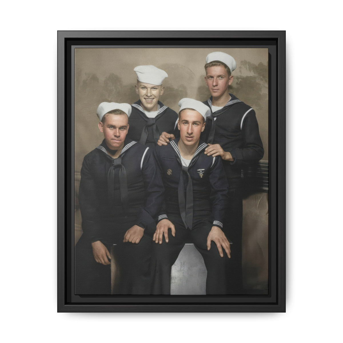 Restored colorized studio portrait of four men in dark naval-style uniforms and white caps, reproduced on framed matte canvas.