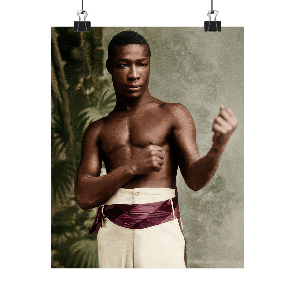 Detail of Hezekiah Moscow’s formal boxing stance, with one fist near his chest and the other extended against a foliage backdrop.