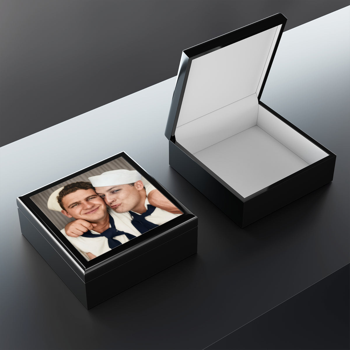  Closed wooden keepsake box with a glossy ceramic tile lid displaying the PAIRE 159 photobooth portrait of two sailors.
