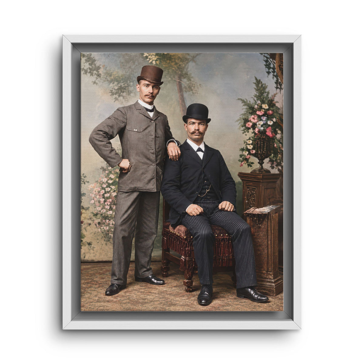 Museum-style archival photo reproduction of an early 20th-century formal double portrait with painted backdrop