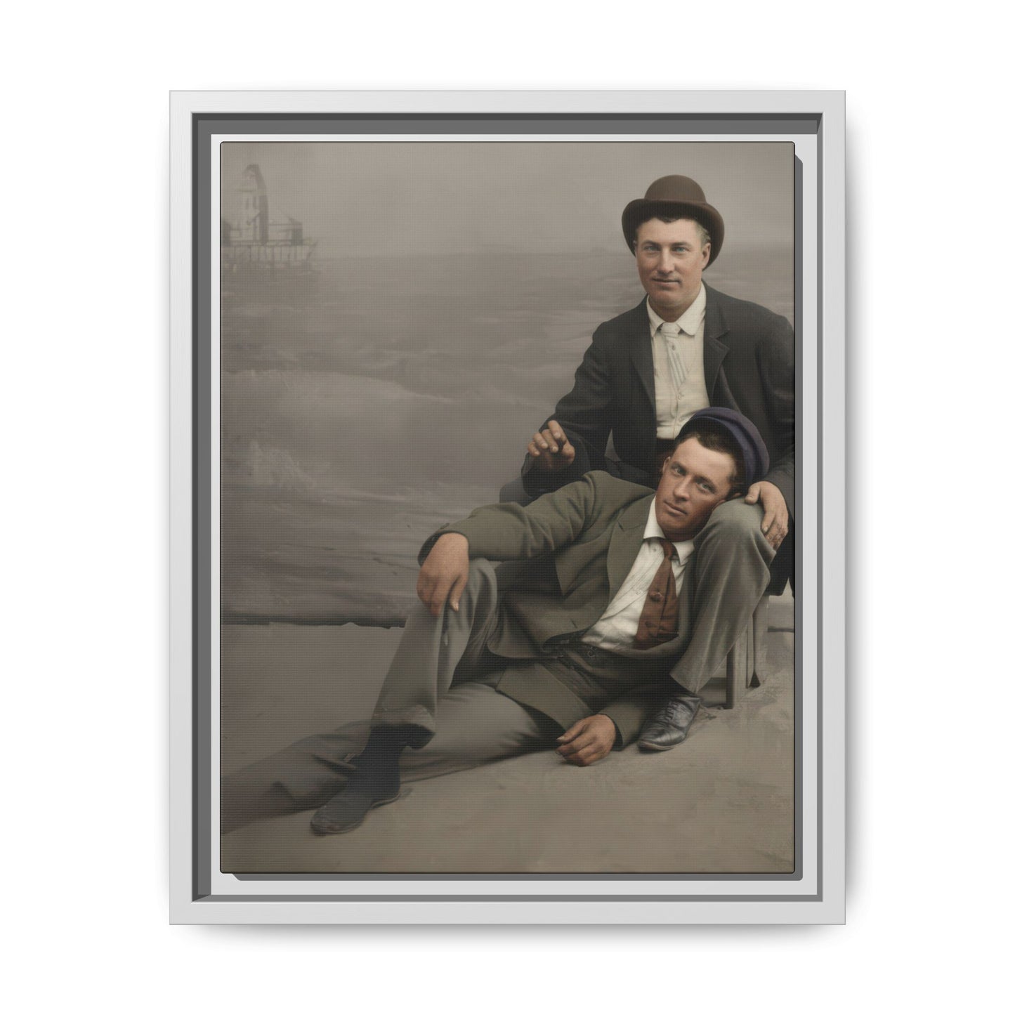 Early 20th century style double portrait with two men in suits posed in a relaxed reclining composition