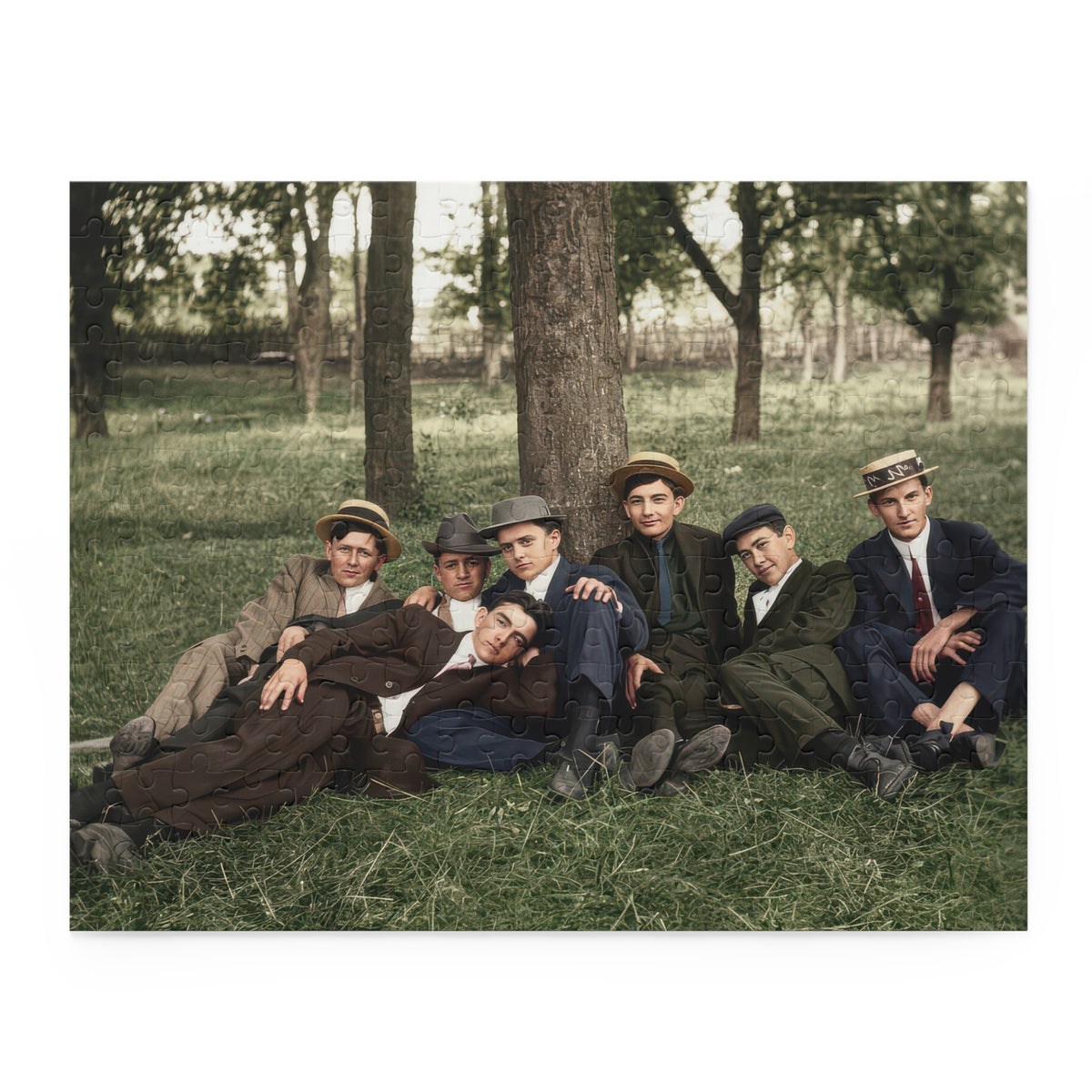 Close-up of the outdoor portrait puzzle showing straw and felt hats, suit folds, and textured tree bark.