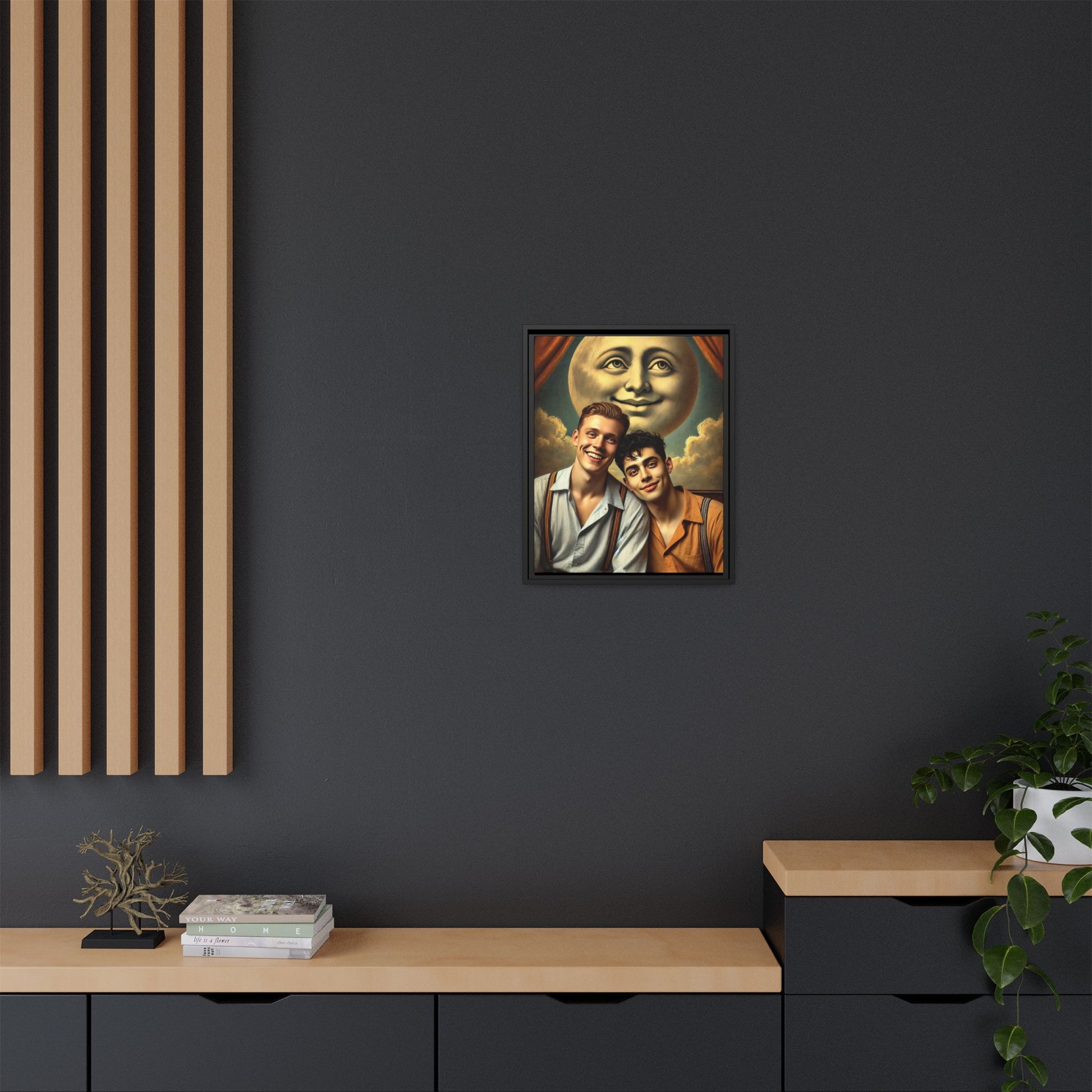 Framed artwork featuring a joyful queer couple in 1930s attire, seated close together beneath a smiling full moon in a theatrical studio setting. A celebration of reclaimed LGBTQ+ narratives in nostalgic portraiture.