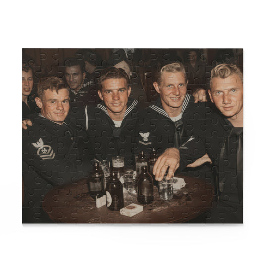 Source artwork for a jigsaw puzzle showing four foreground sailors with arms across shoulders around a wooden table with bottles and glasses