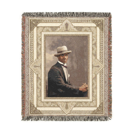 African American man in boater hat woven cotton blanket with fringe in heirloom-style home décor format