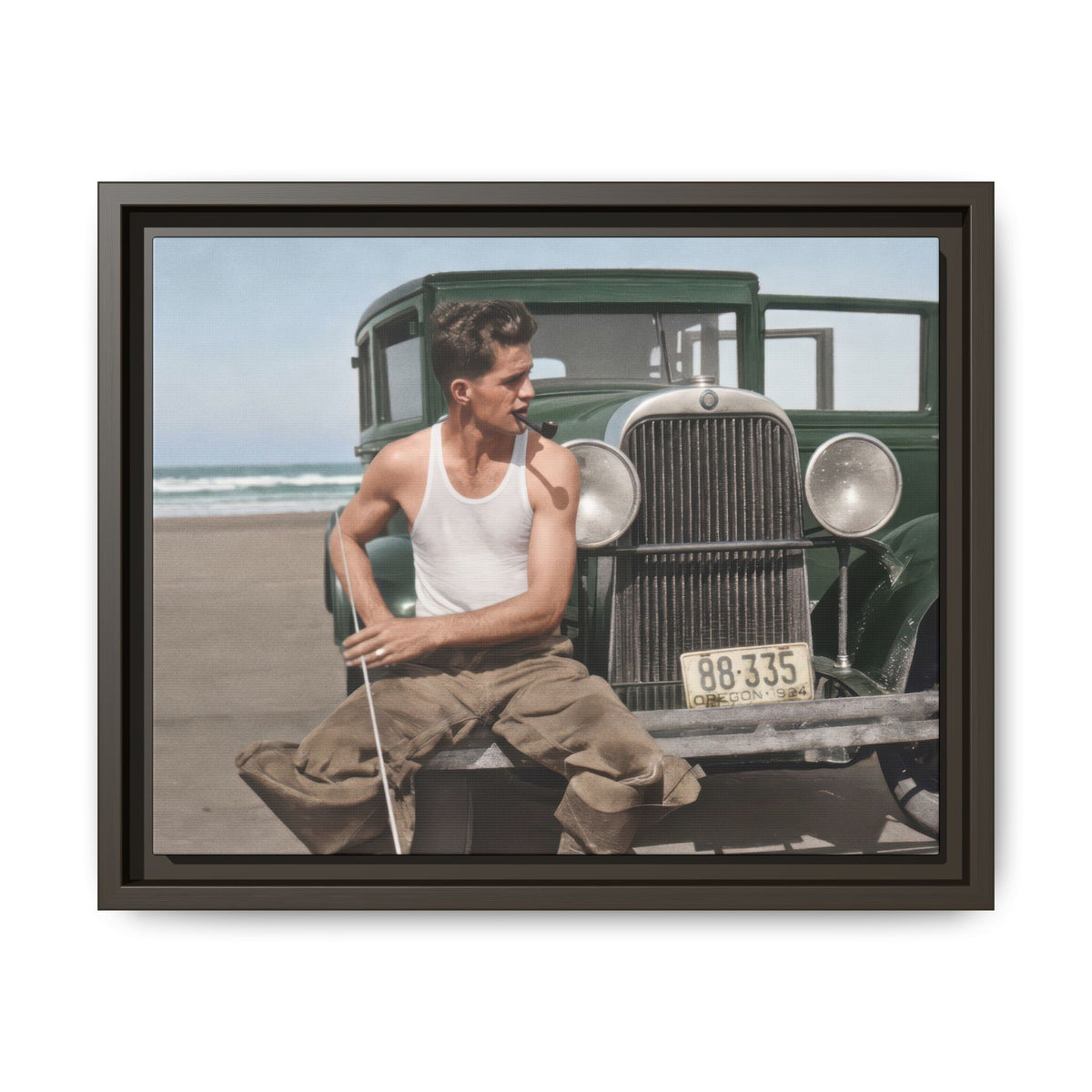 Célibataire 008 coastal male portrait featuring an open automobile door, front bumper, muted blue-gray bodywork, and sandy surroundings.