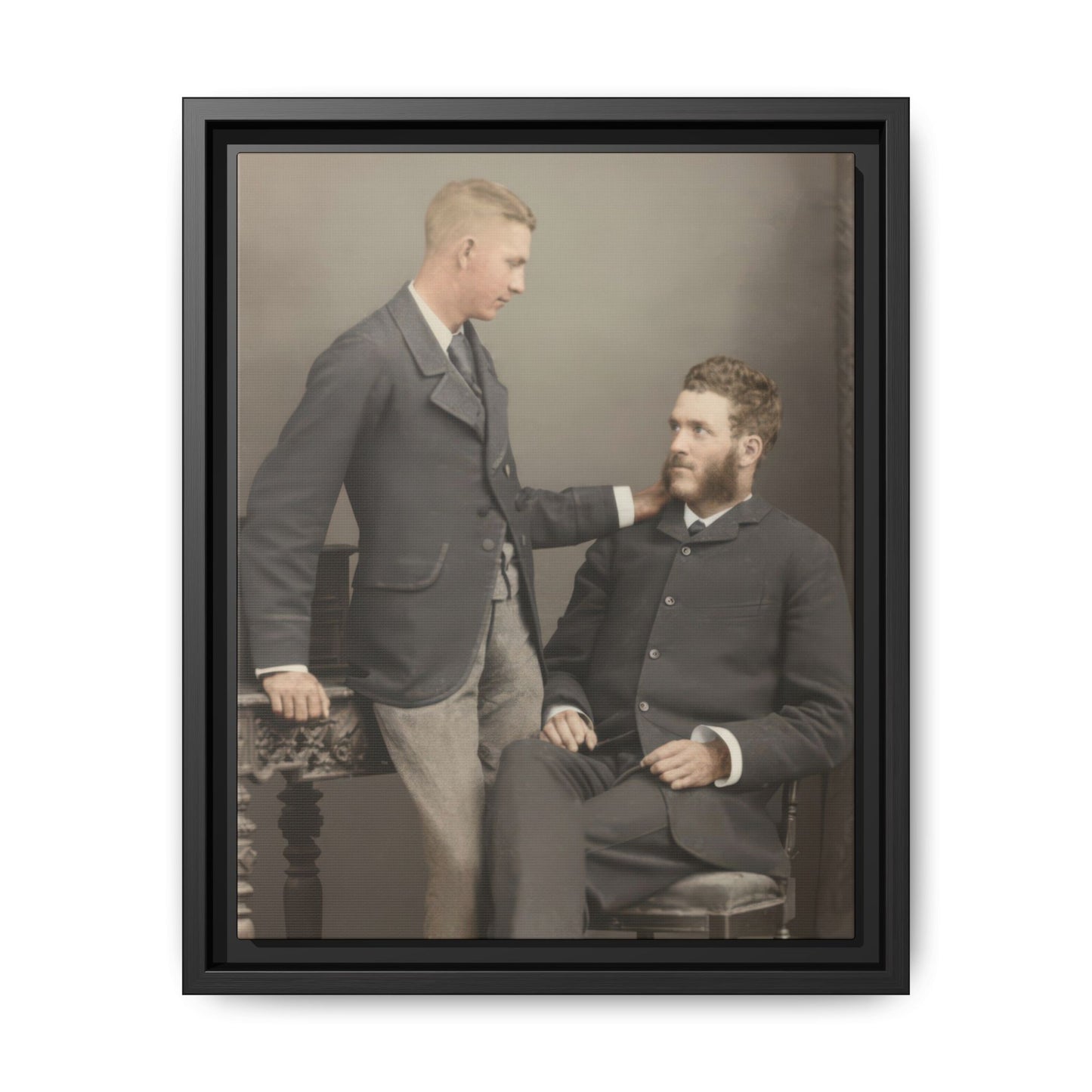 Vintage studio portrait of two men with hand on shoulder framed canvas wall art
