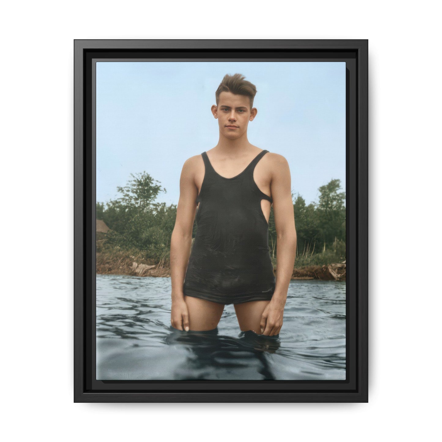 Man standing in shallow water wearing vintage swimwear early 1900s 
