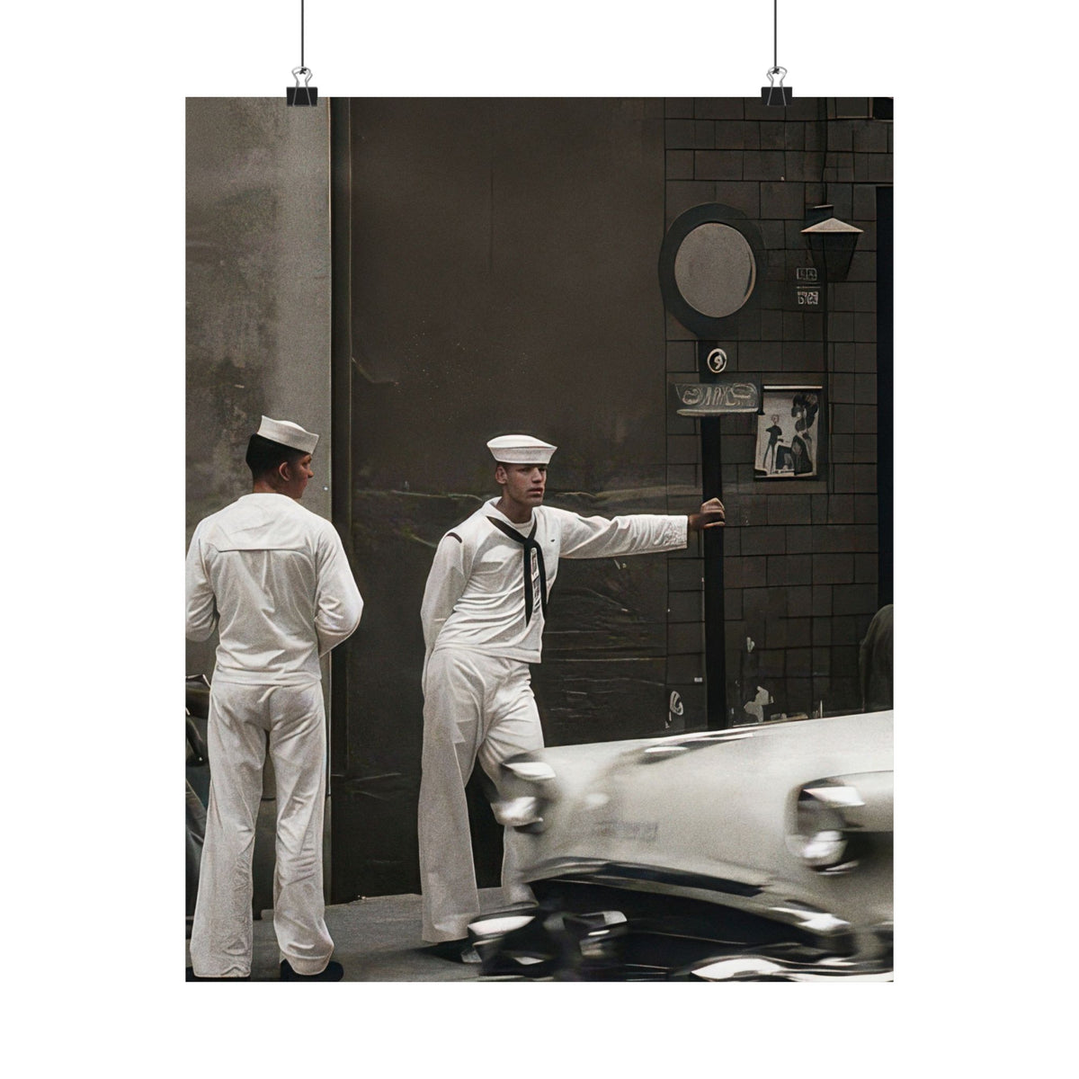 Vintage photography poster reproducing a circa 1950–1960 street photograph of two sailors beside a dark commercial building.