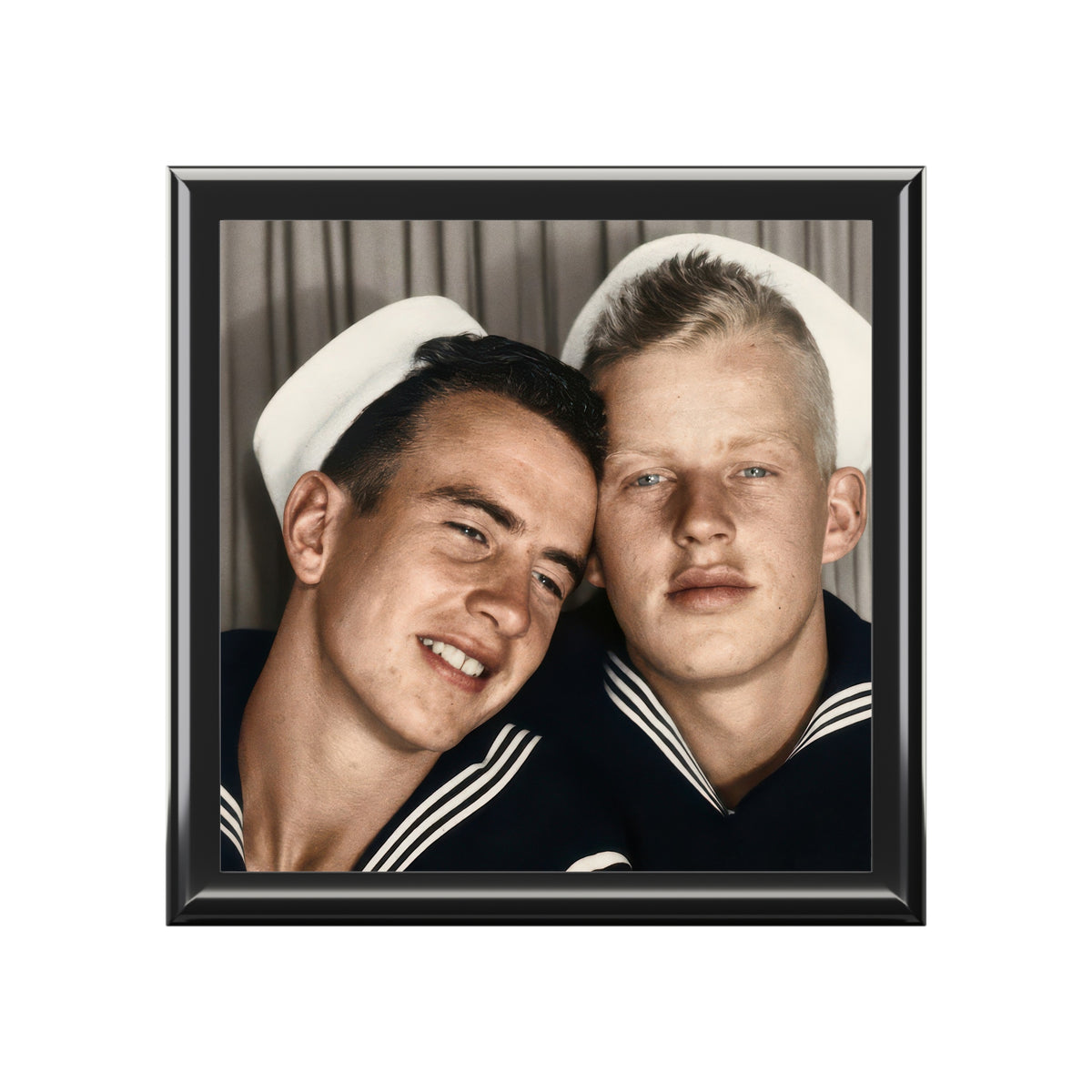 Closed glossy wooden keepsake box with ceramic tile lid showing two sailors leaning their heads together in a vintage photobooth portrait.