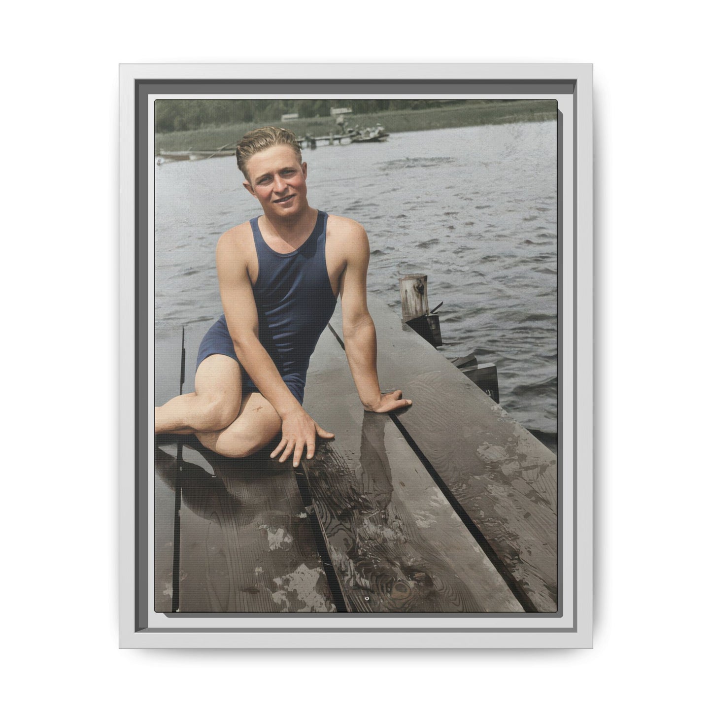 Historical waterfront portrait featuring a seated man in vintage swimwear on a dock 