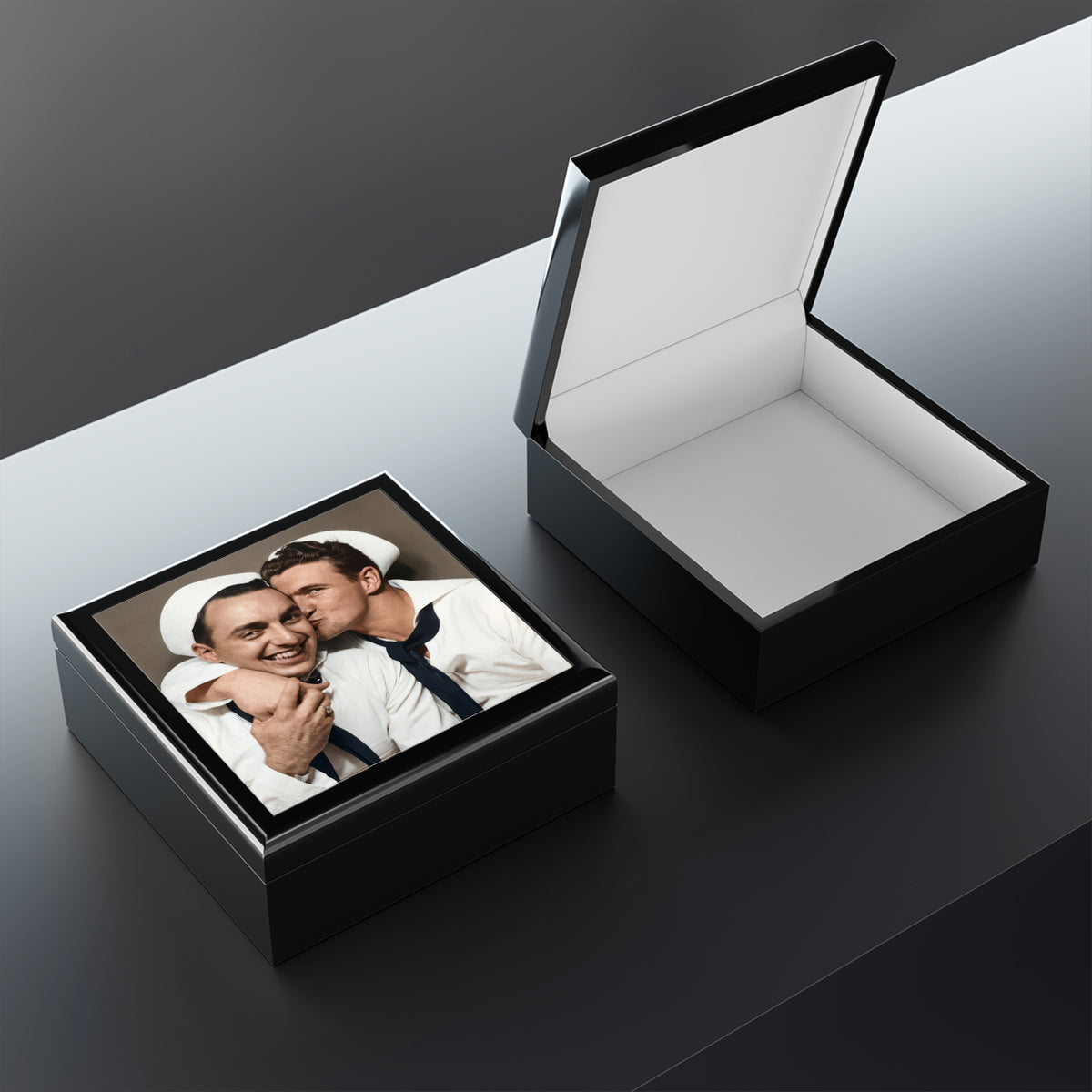 Open wooden keepsake box showing felt-lined interior and lid tile with a vintage photobooth portrait of two sailors.