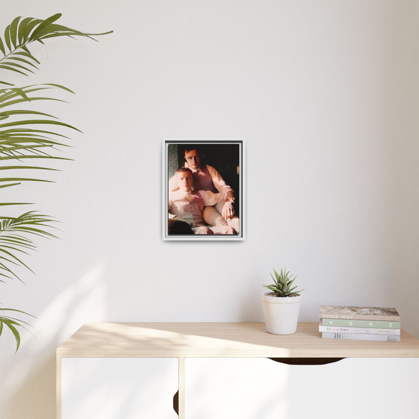 Restored vintage photograph of James and Henry, an early 1900s LGBTQ+ couple from Dayton, Ohio, sharing an intimate, sunlit moment. Framed matte canvas print celebrating love, devotion, and LGBTQ+ history.