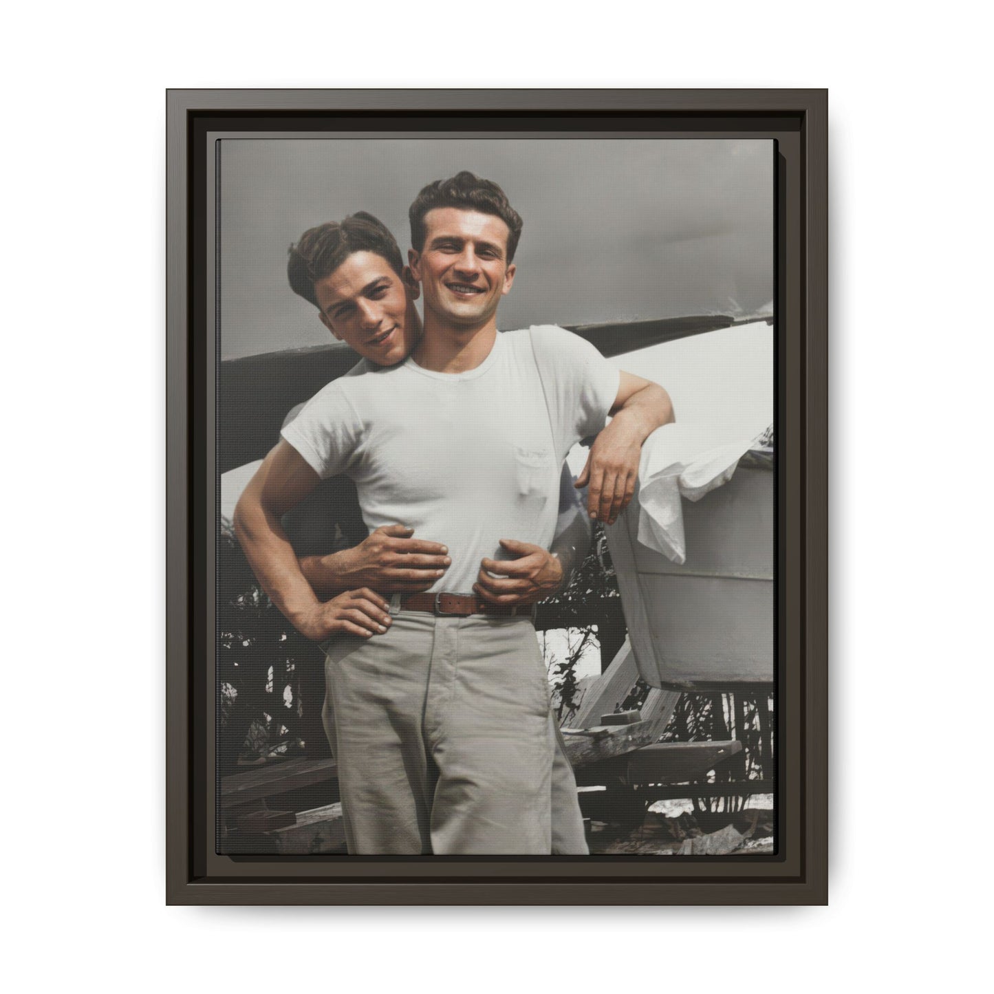 Mid-20th century historical photograph reproduction with close pose and shoreline setting