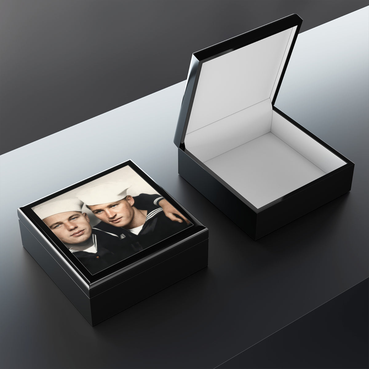 Open wooden keepsake box showing felt lining and a raised lid, with the Paire 078 sailor portrait visible on the lid exterior.