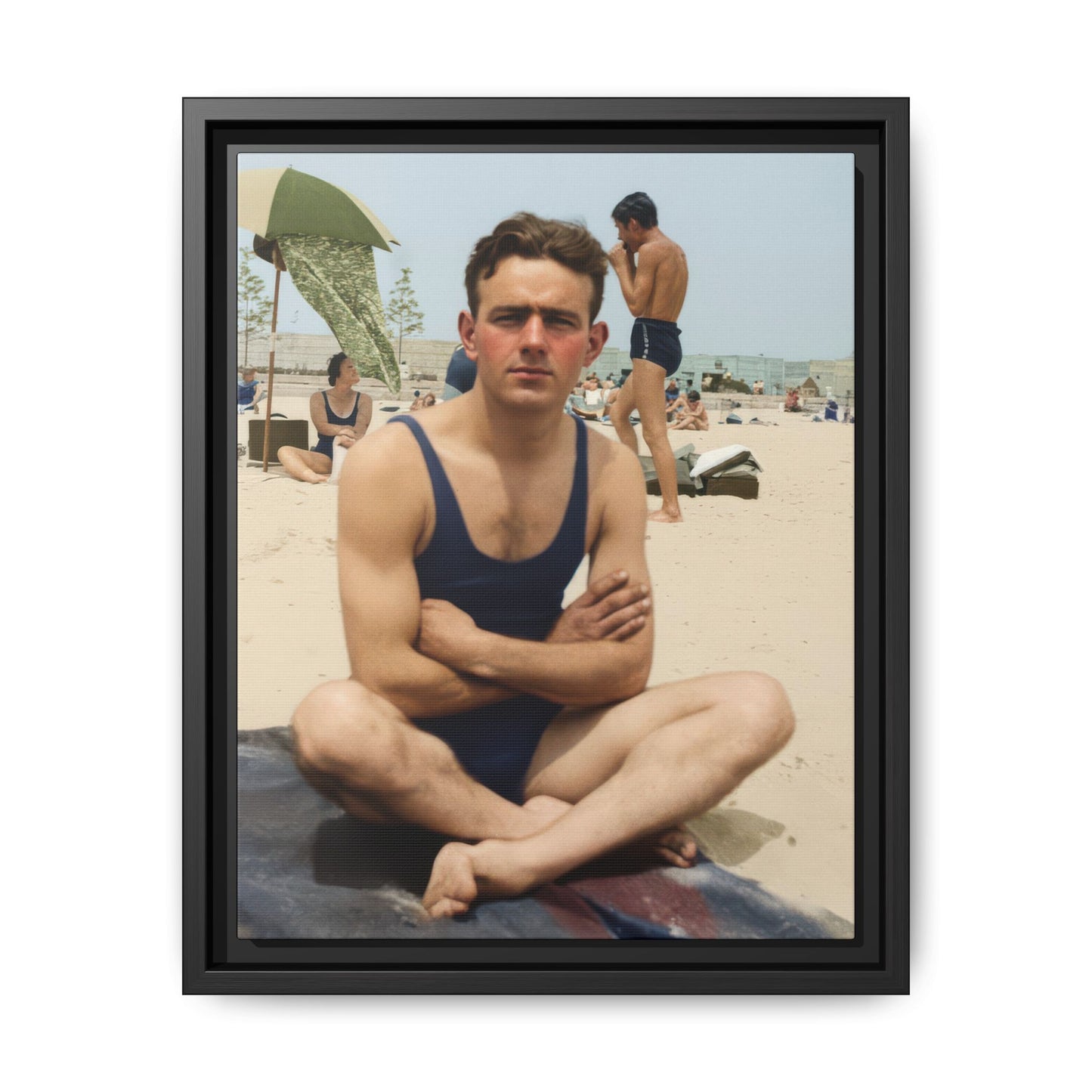 Restored vintage photograph of a seated man in dark bathing suit on a beach 