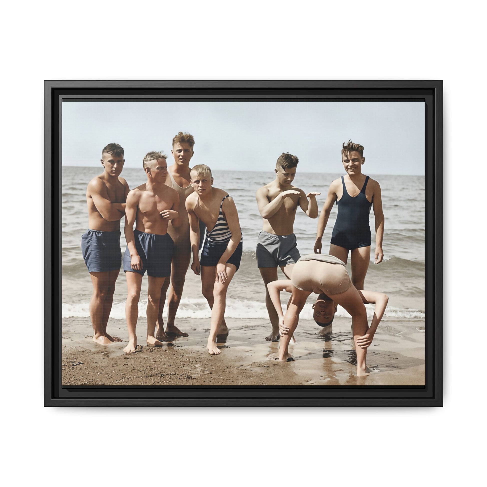 Framed matte canvas wall art showing an interwar beach group portrait with sea behind 