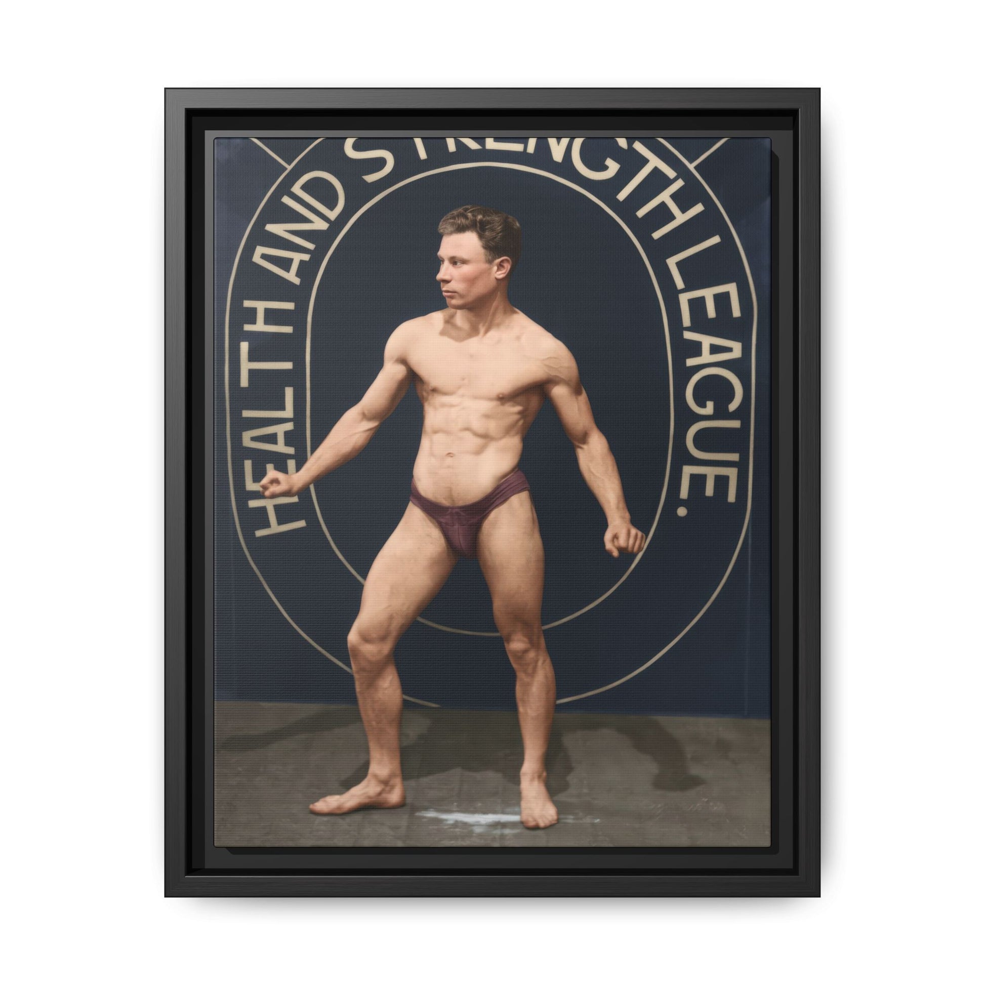 Vintage physical culture athlete posing before Health and Strength League banner 
