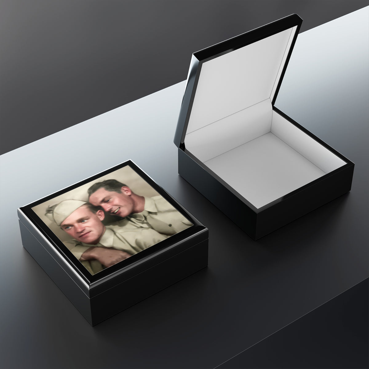  Open wooden keepsake box showing felt lining and a raised lid, with the uniformed double portrait visible on the lid exterior.