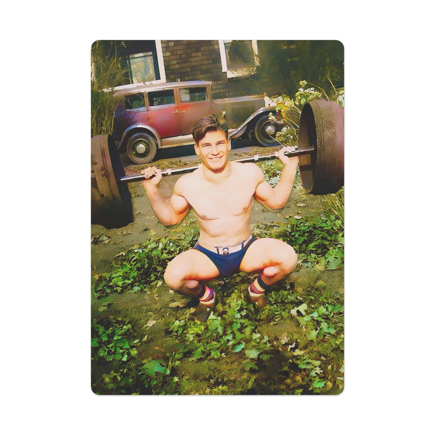 A vibrant vintage photo of a shirtless man squatting with a barbell in a lush, rustic backyard. Behind him sits a 1928 Model A Ford, parked in front of a charming home, creating a nostalgic, timeless scene.