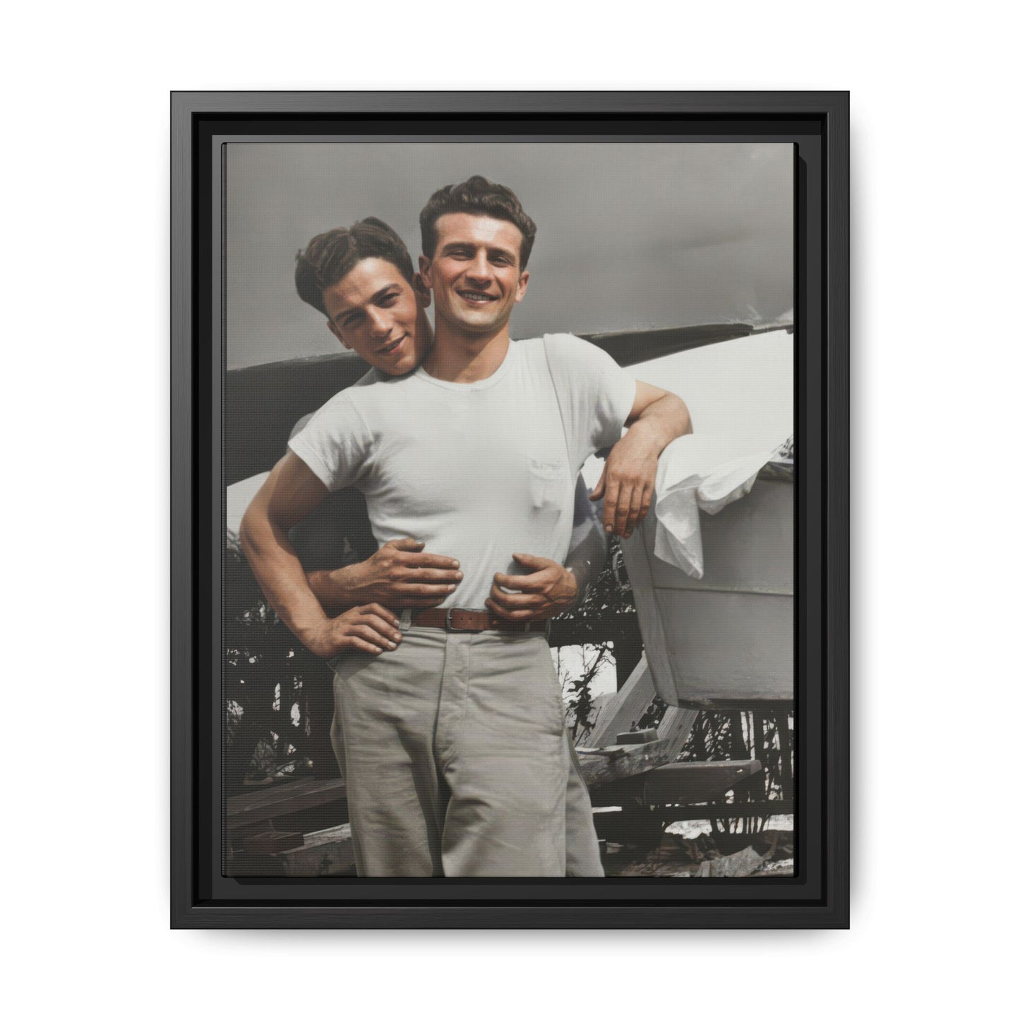 Vintage outdoor portrait of two figures beside a boat framed canvas wall art