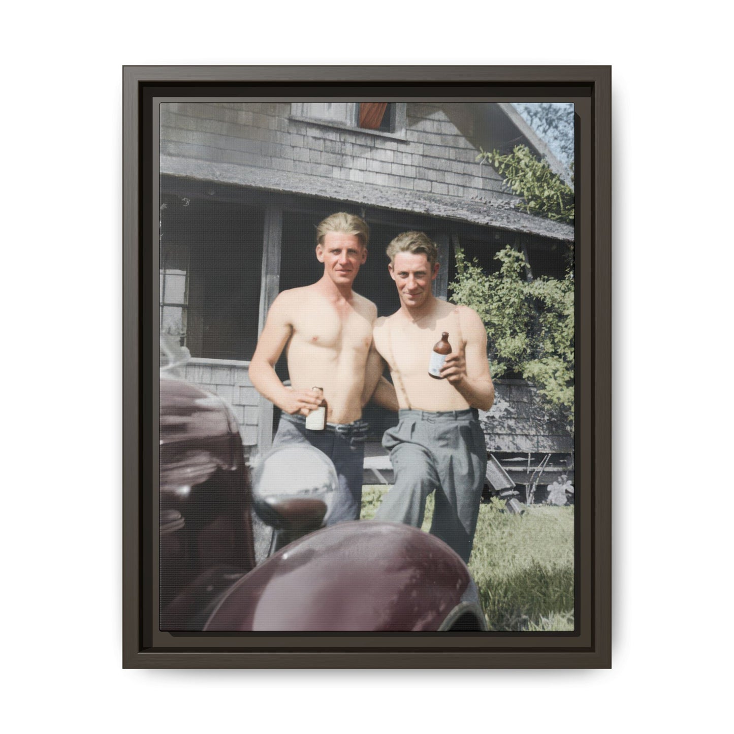 Mid-century historical photograph with shirtless figures holding bottles outdoors