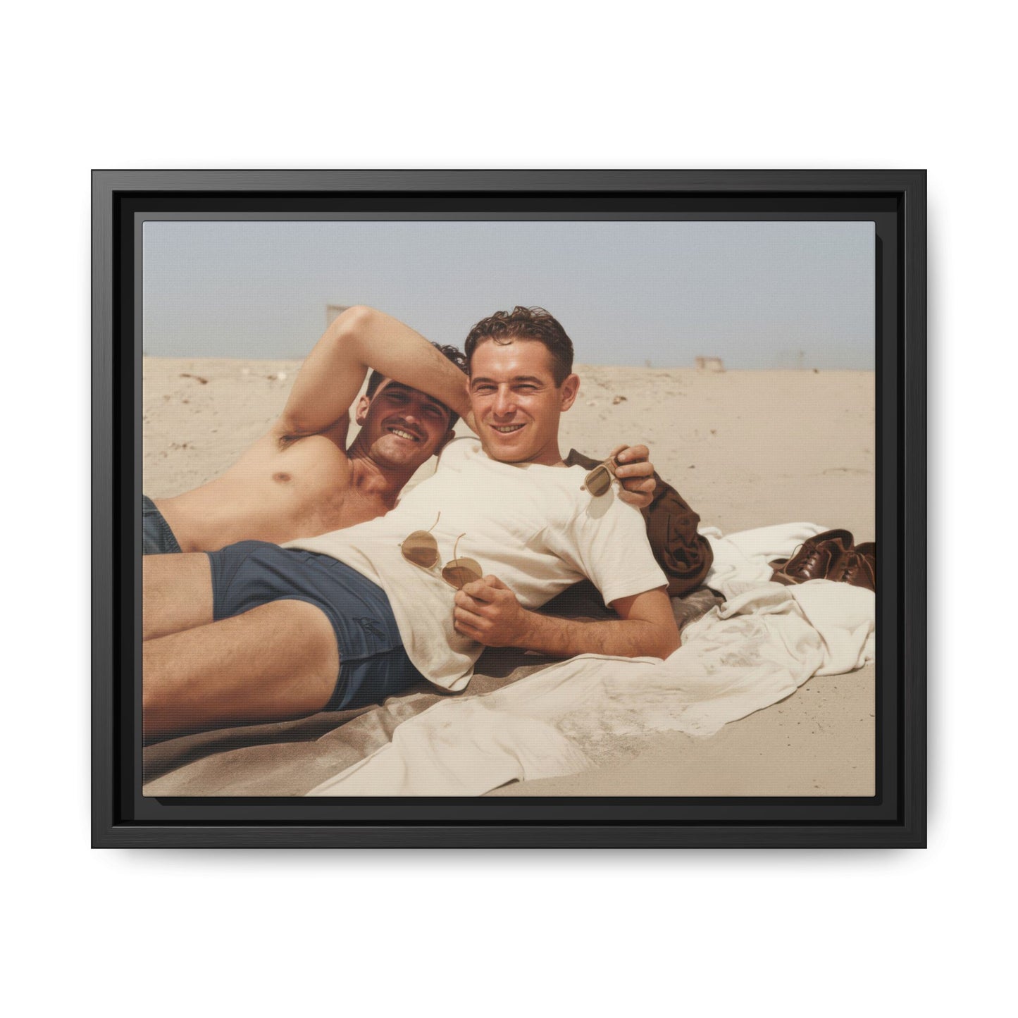 Two men reclining on beach with blanket early 20th century 