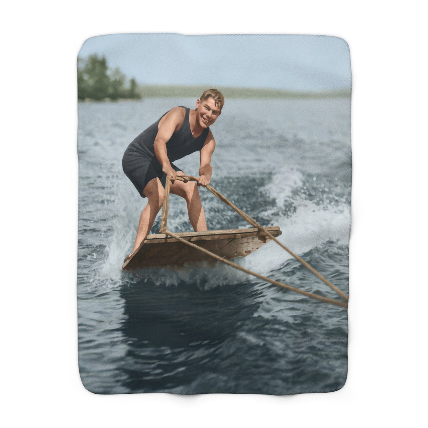 Heirloom sherpa blanket featuring man in swimwear on a small watercraft holding a tow line 