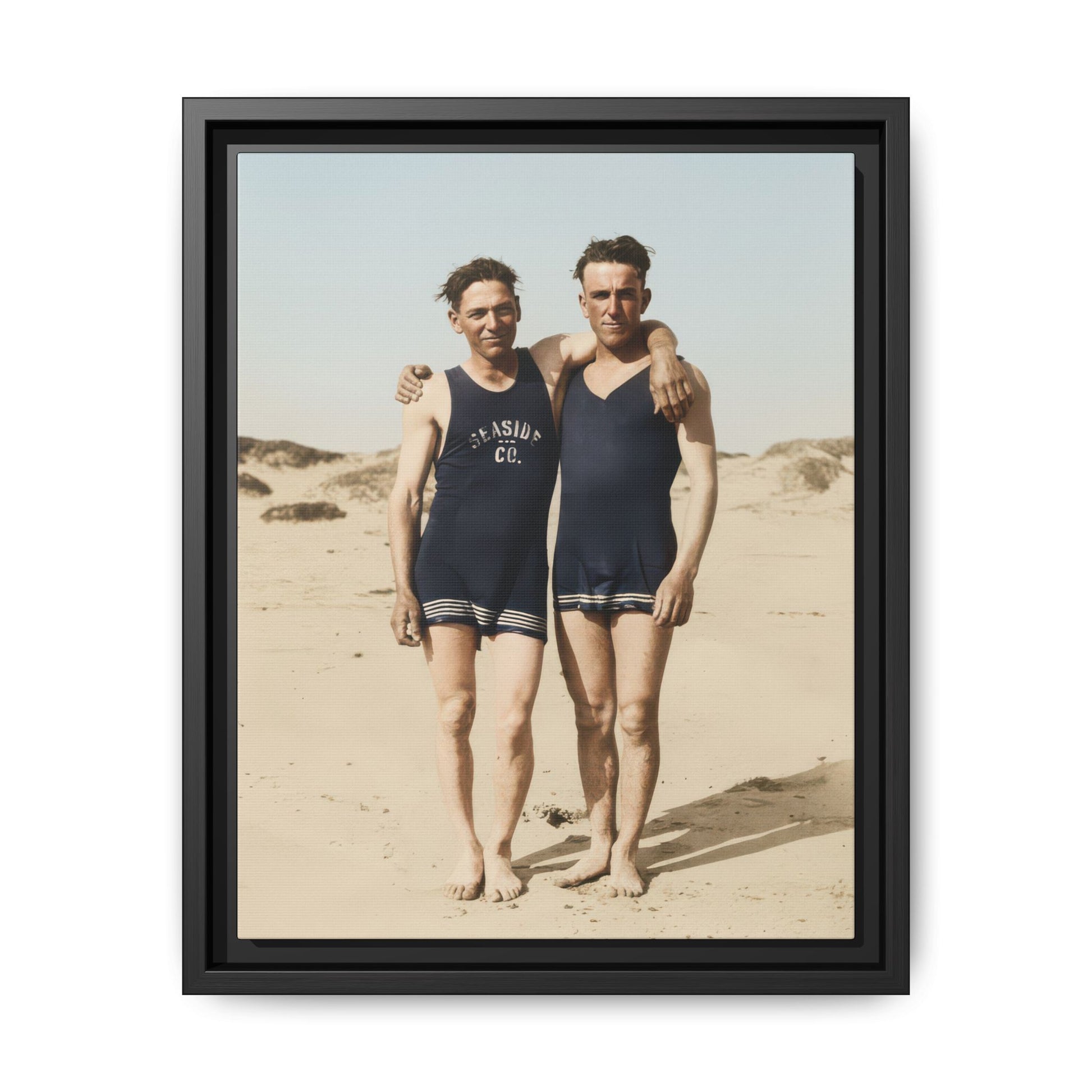Restored vintage beach photograph of two men standing in matching swimwear 