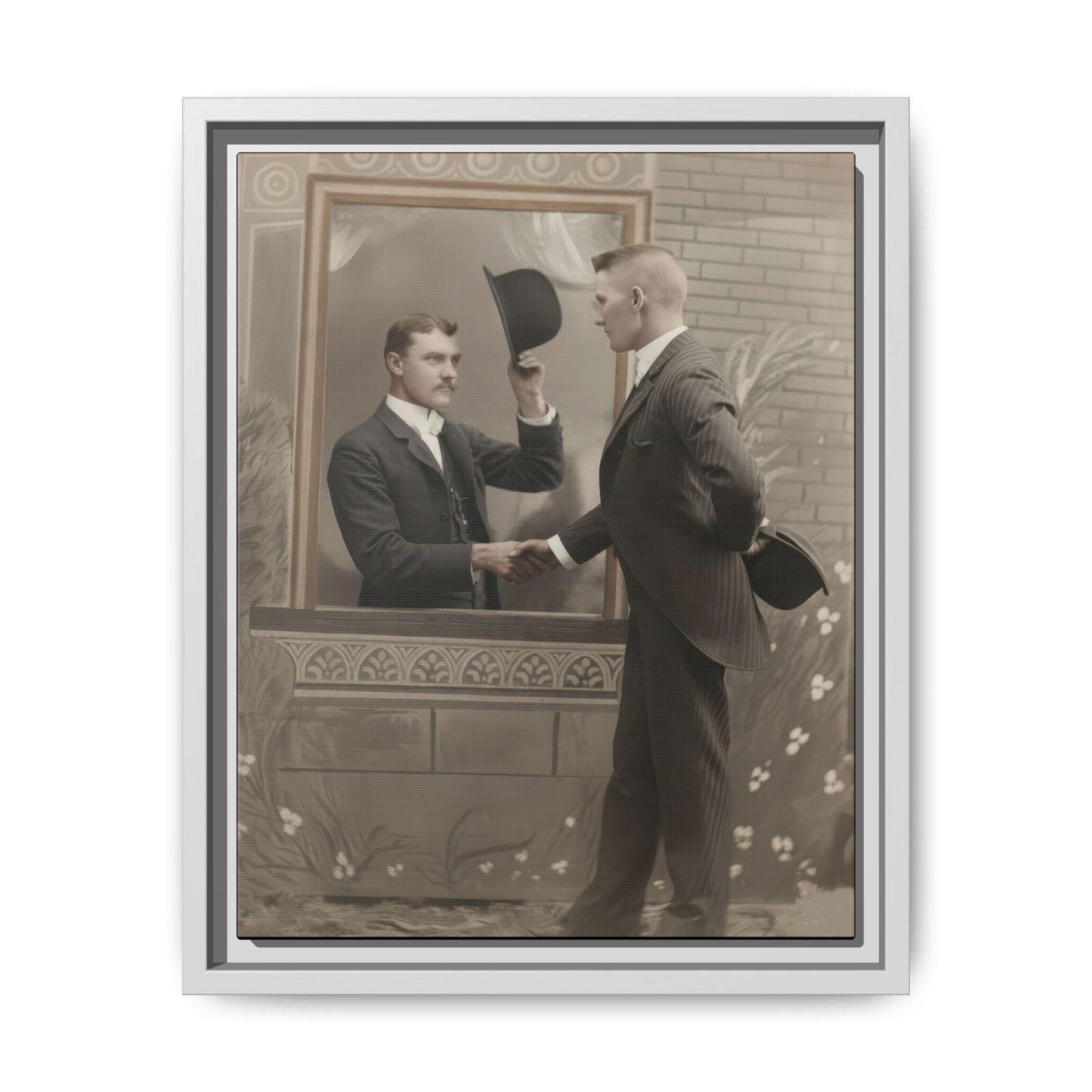 Vintage studio photograph of two formally dressed men with hats in an illusion-style handshake scene